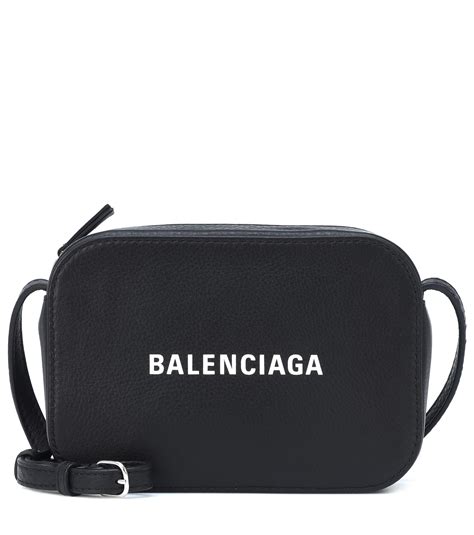 white balenciaga bag with black writing